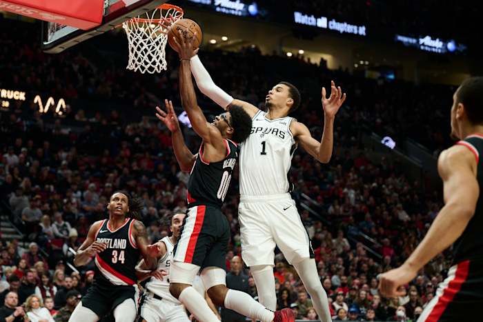 Dec 28, 2023; Portland, Oregon, USA; San Antonio Spurs center Victor Wembanyama (1) blocks a shot during the first half against Portland Trail Blazers guard Scoot Henderson (00) at Moda Center.